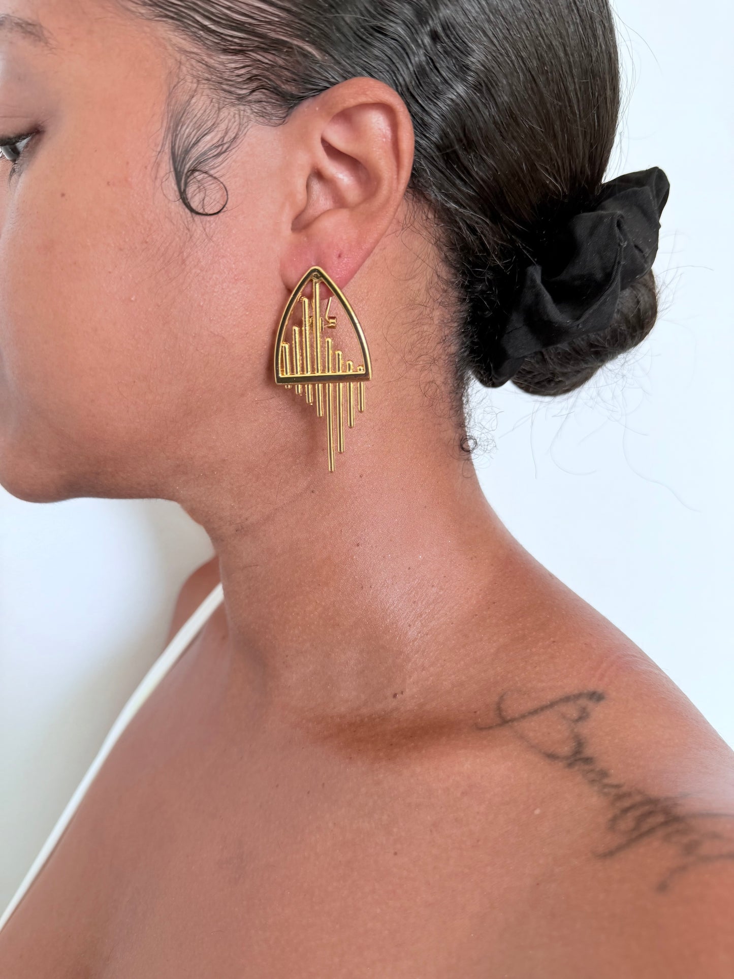 Boucle d'oreille fantaisie dorée