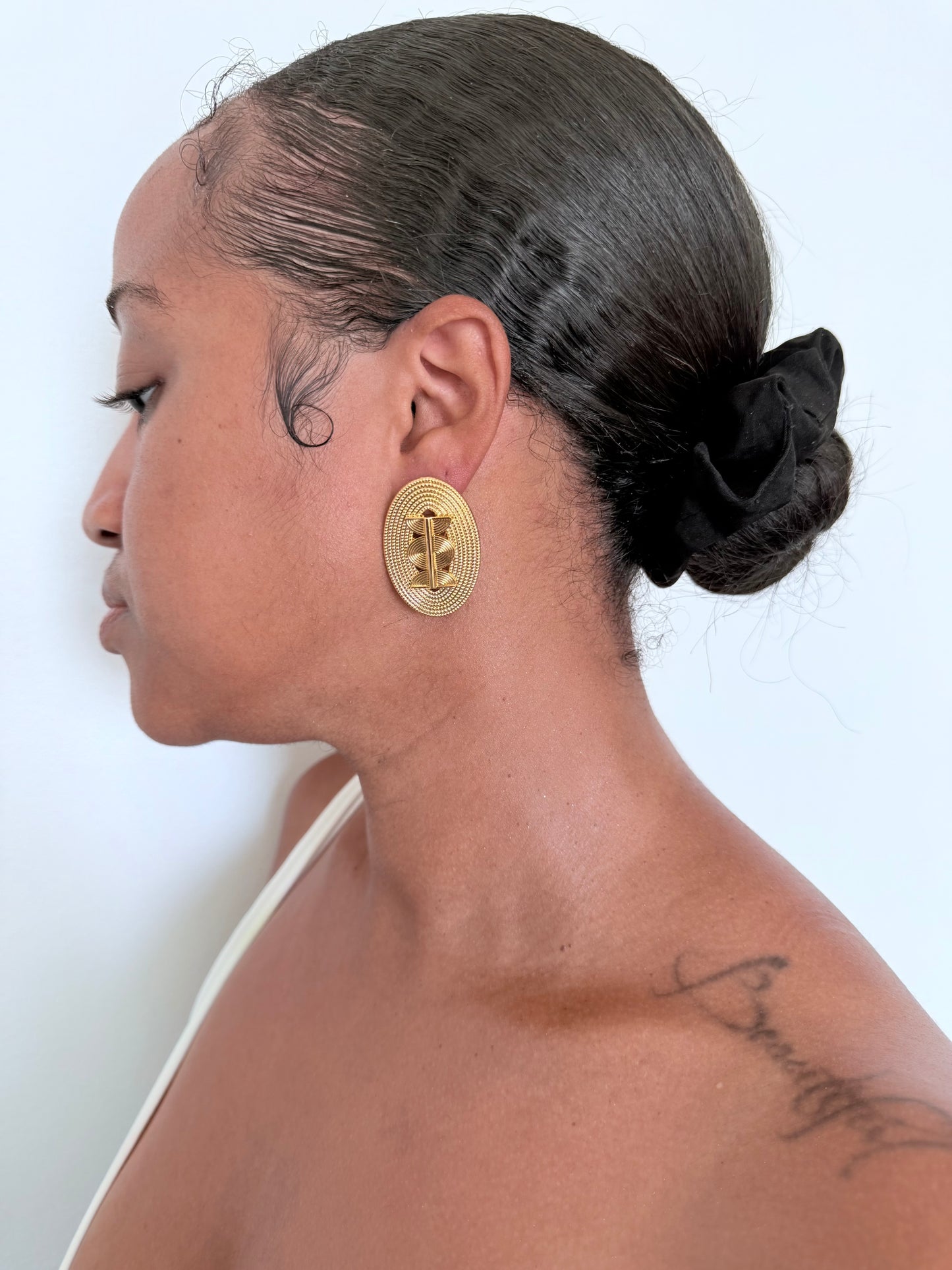 Boucle d'oreille fantaisie dorée