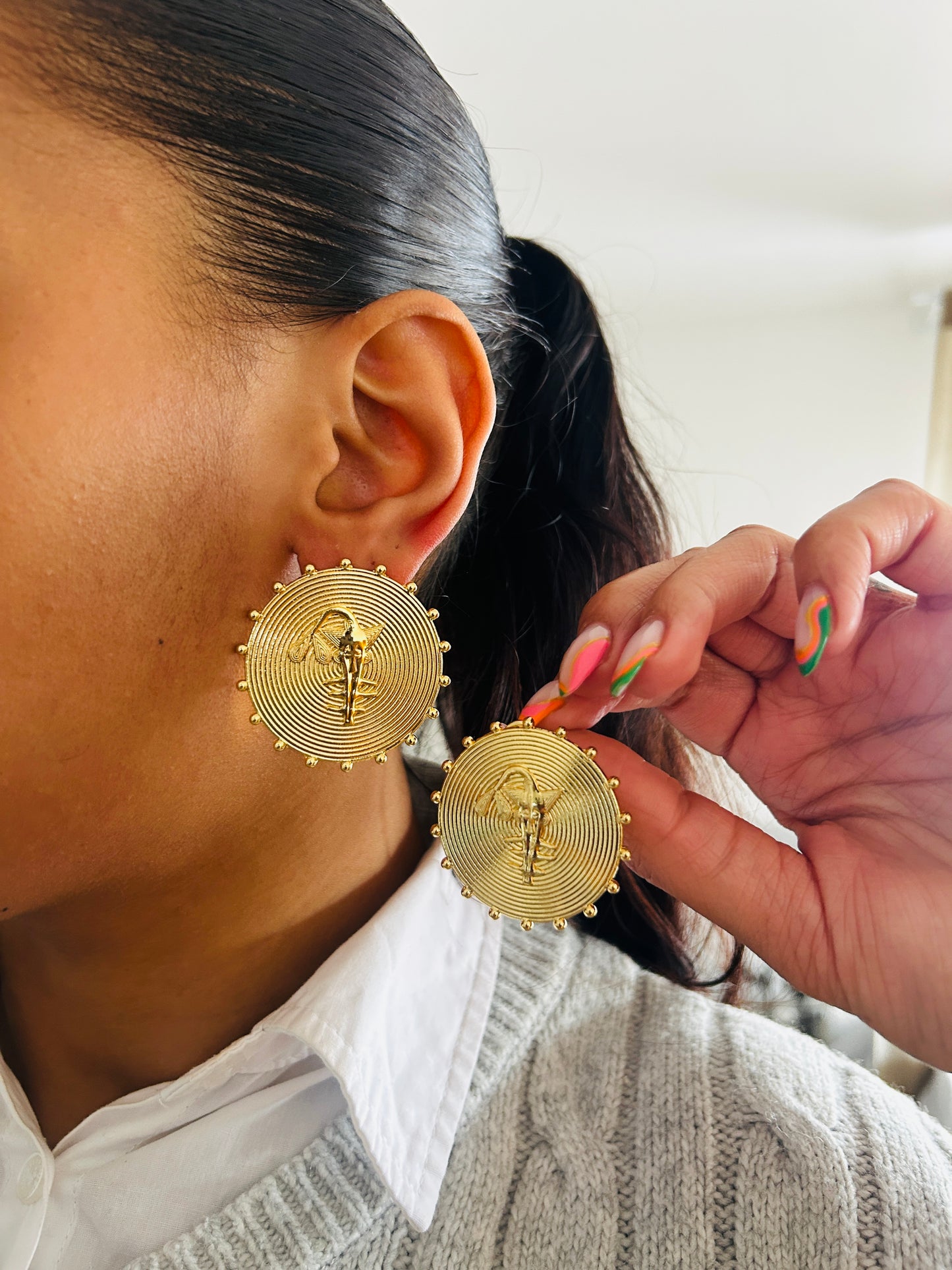 Boucle d'oreille fantaisie dorée
