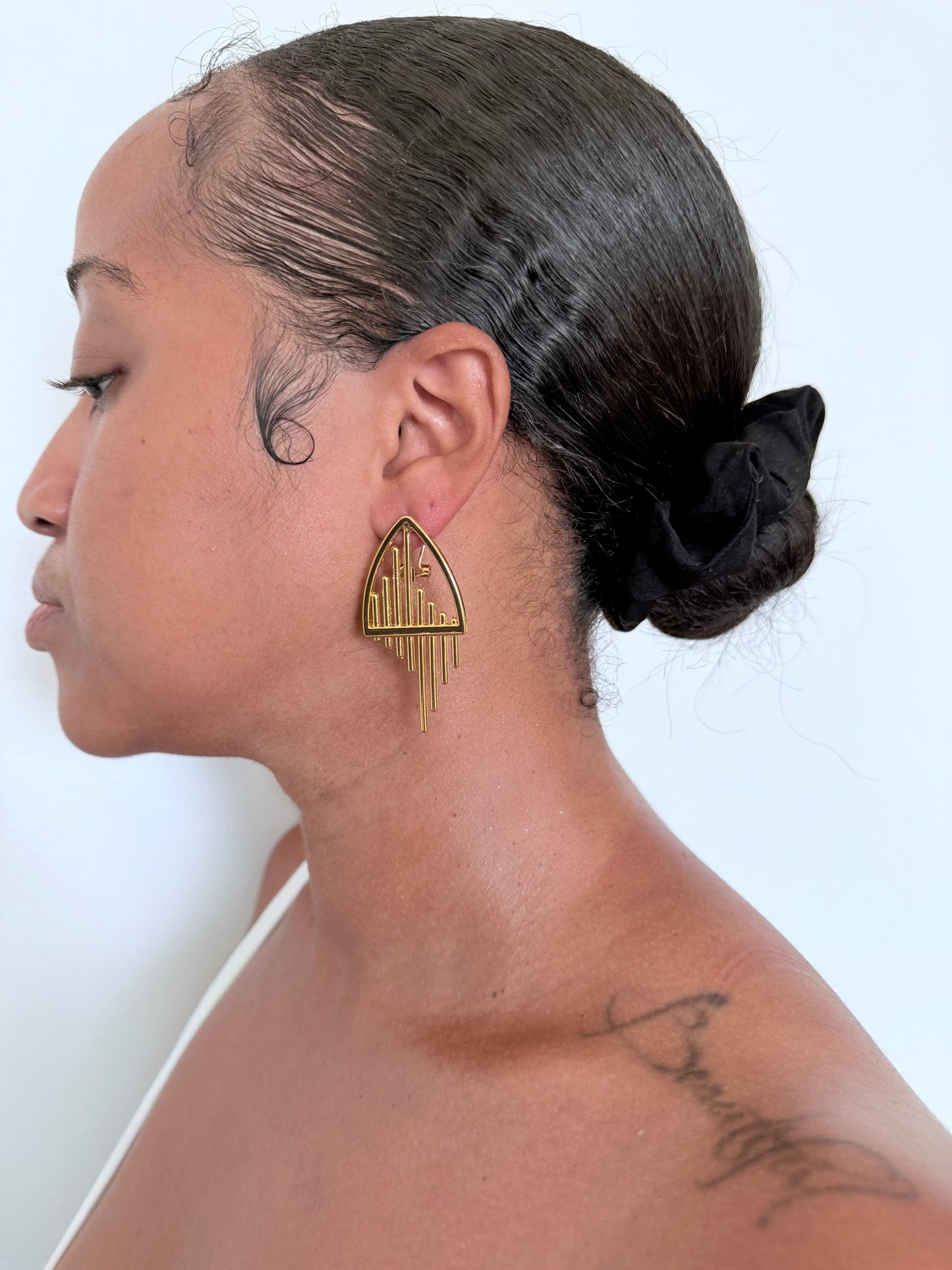 Boucle d'oreille fantaisie dorée