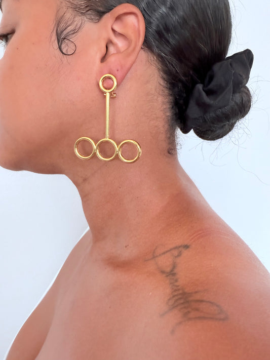Boucle d'oreille fantaisie dorée
